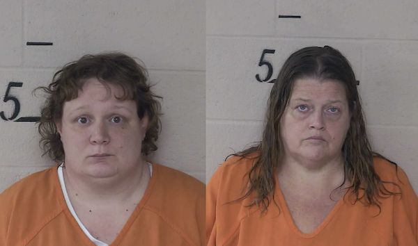 Mugshots of two females wearing standard orange jail attire, standing in front of a wall displaying the number 5 for height reference.